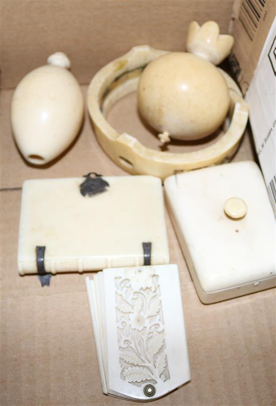 Ivory stamp box, a book shaped box, an aide memoire, a toy? and a stand, late 19th / early 20th century